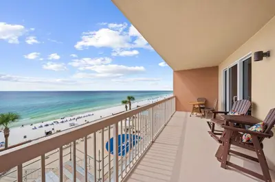 a balcony with a view of the beach at Music City Flamingo at Sunrise Beach Resort #705 by Nautical Properties in Panama City Beach