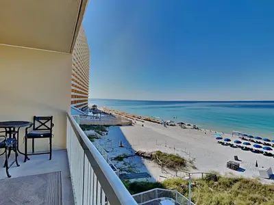 a balcony with a view of the beach and ocean at Seychelles #402 in Panama City Beach