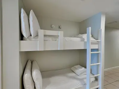 a room with two bunk beds and a ladder at Seychelles #402 in Panama City Beach