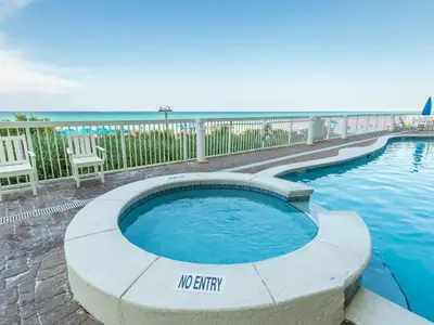 a swimming pool with a no entry sign next to the ocean at Seychelles #402 in Panama City Beach