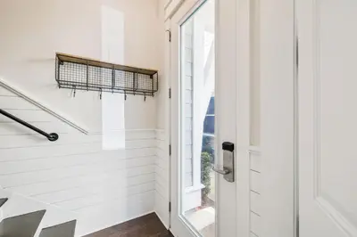 a hallway with a door and a window at Sun and Sand for 6 - 167 Milestone Dr Unit C in Inlet Beach