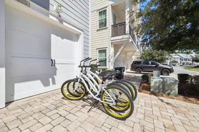 two bikes are parked next to a building at Sun and Sand for 6 - 167 Milestone Dr Unit C in Inlet Beach