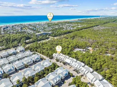 an aerial view of a resort with a hot air balloon in the sky at Sun and Sand for 6 - 167 Milestone Dr Unit C in Inlet Beach