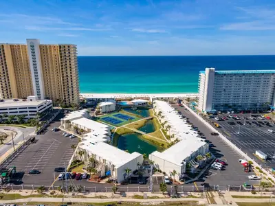 an aerial view of a resort and the ocean at Charming Beachfront Condo with Stunning Views in Panama City Beach