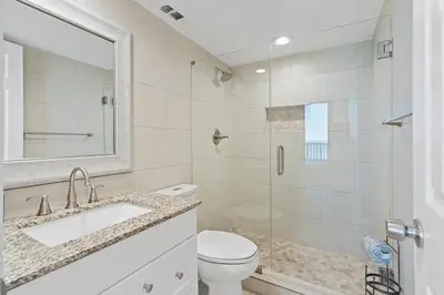 a bathroom with a toilet and a sink and a shower at Book Me Baby! License to Chill One Seagrove Place in Seagrove Beach