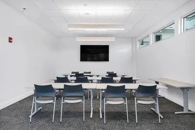 a conference room with a table and chairs at Book Me Baby! License to Chill One Seagrove Place in Seagrove Beach