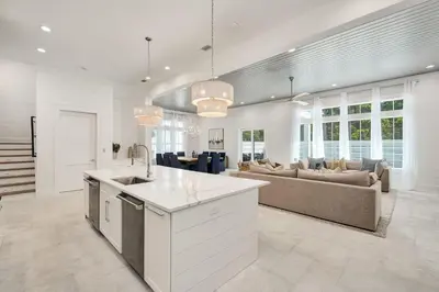 a large kitchen and living room with a couch at Oz by The Sea in Inlet Beach