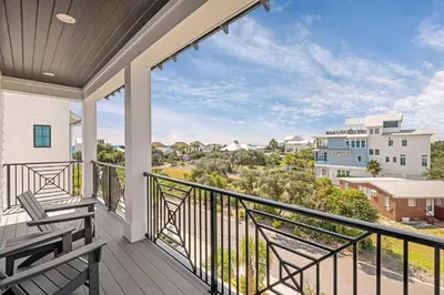 a balcony with a view of a city at Oz by The Sea in Inlet Beach