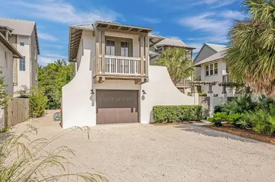a house with a balcony and a driveway at North Winston Villa in Inlet Beach
