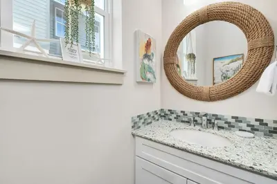 a bathroom with a sink and a mirror at North Winston Villa in Inlet Beach