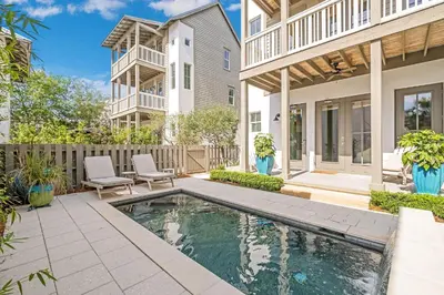 a house with a swimming pool in a yard at North Winston Villa in Inlet Beach