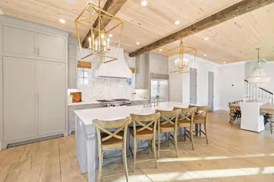 a kitchen with a table and chairs in a room at Traveler's Rest in Inlet Beach