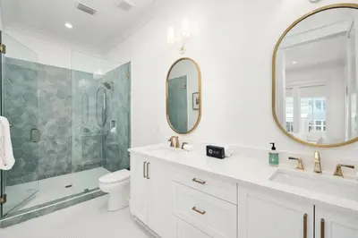 a bathroom with a sink and a shower and a toilet at Marisol 30A in Inlet Beach
