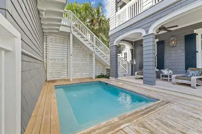 a swimming pool in the middle of a house at Waverly at Watersound in Watersound Beach