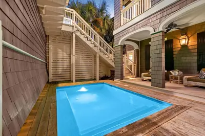 a swimming pool in the backyard of a house at Waverly at Watersound in Watersound Beach