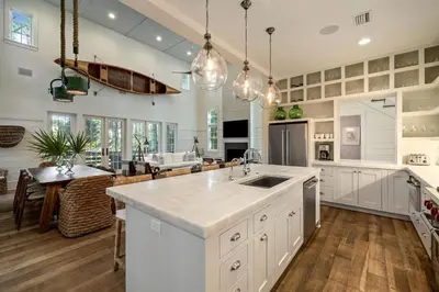 a kitchen with a large island with a sink in it at Waverly at Watersound in Watersound Beach