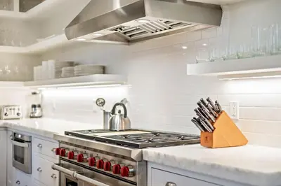 a kitchen with a stove and a sink at Waverly at Watersound in Watersound Beach