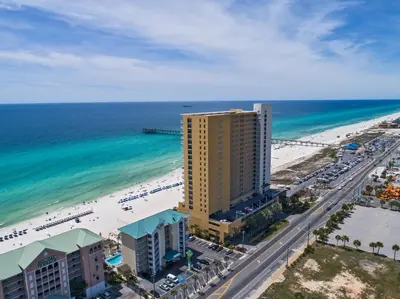 an aerial view of a hotel and the beach at Sterling Reef Beach Resort in Panama City Beach