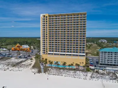 an aerial view of a large building on the beach at Sterling Reef Beach Resort in Panama City Beach