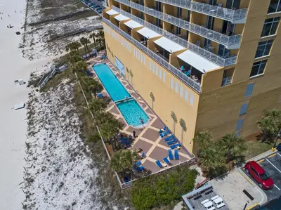 an overhead view of a hotel with a swimming pool at Sterling Reef Beach Resort in Panama City Beach