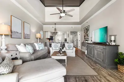 a living room with a couch and a ceiling fan at High Pointe Resort Unit 44E in Inlet Beach