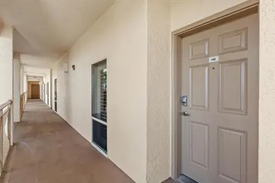 a hallway with a white door in a house at High Pointe Resort Unit 44E in Inlet Beach