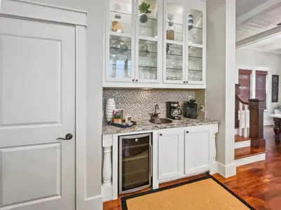 a kitchen with white cabinets and a sink at 116 Surfer Ln l Resort Style Community Pool l Walk to Rosemary Beach in Rosemary Beach