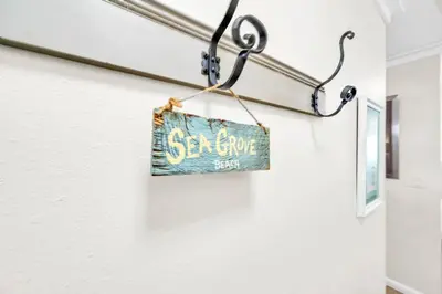 a sign hanging on a wall with the wordservice at Book Me Baby! You are in Luck! I Am Gulf Front! in Santa Rosa Beach