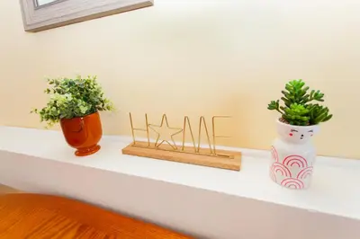 a shelf with two vases and plants on it at Summit 903 in Panama City Beach
