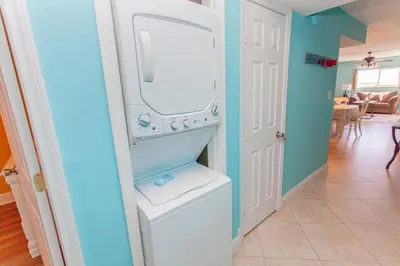 a white washer and dryer in a room at Regency 1023 in Panama City Beach