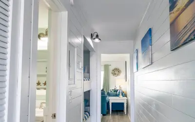a hallway with a door leading to a bedroom at Summit 811 in Panama City Beach