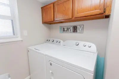 a white washer and dryer in a laundry room at Moonspinner 808B in Panama City Beach