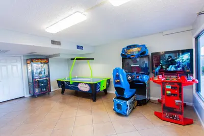 a room with a game room with a table and a game console at Summit 627 in Panama City Beach
