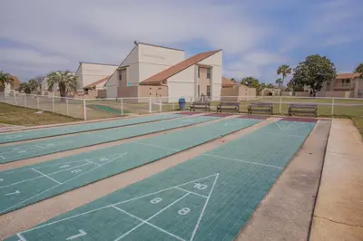 a tennis court in front of a building at Horizon South 58-203 in Panama City Beach