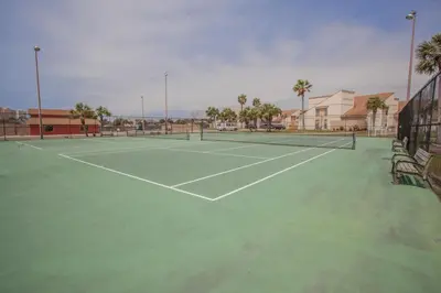a tennis court with two tennis courts at Horizon South 58-203 in Panama City Beach