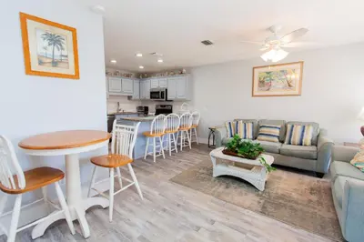 a living room with a couch and a table at Horizon South 58-203 in Panama City Beach