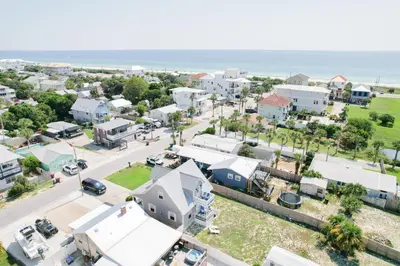 an aerial view of a small town near the ocean at 125 E Lakeshore DR in Panama City Beach
