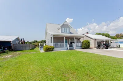 a house with a lawn in front of it at 125 E Lakeshore DR in Panama City Beach