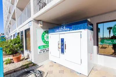 a building with a white door on the side of it at Summit 203 in Panama City Beach