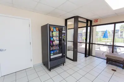 a vending machine in a building with a door open at Sugar Beach E2 in Panama City Beach