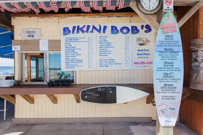 a sign for a bikin box with a surfboard on it at Regency 501 in Panama City Beach