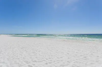 a sandy beach with the ocean in the background at Regency 501 in Panama City Beach