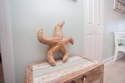 a wooden statue sitting on top of a wooden box at Ocean Ritz 1501 in Panama City Beach