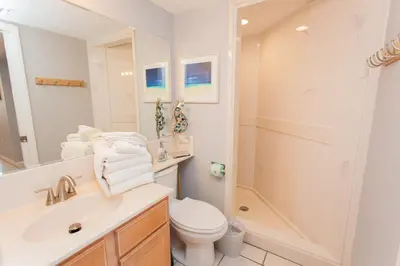 a bathroom with a sink and a toilet and a shower at Summerhouse 1005a in Panama City Beach