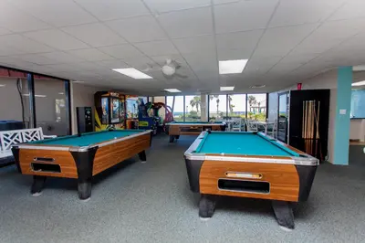 a room with two pool tables in a gym at Summerhouse 1005a in Panama City Beach