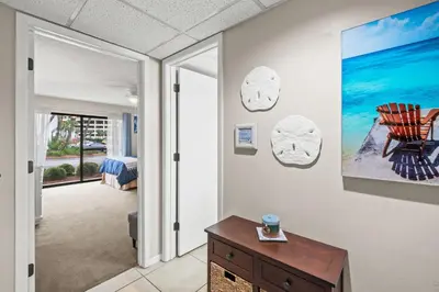 a living room with a view of the ocean at Edgewater Golf Villas #3105 by Book That Condo in Panama City Beach