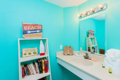 a bathroom with a sink and a mirror at Shores of Panama 2220 in Panama City Beach