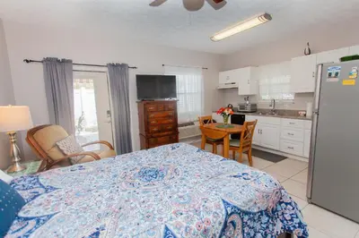 a kitchen with a table with a blue and white table cloth at Palms A4 Studio in Panama City Beach