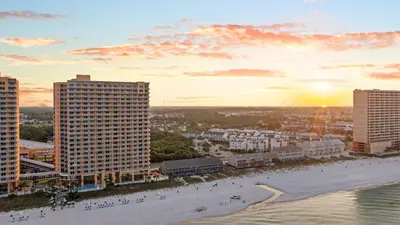 an aerial view of a city with a beach and buildings at West End Coastal Escape Renovated 1BR Condo w Pool Beach Access 72 in Panama City Beach