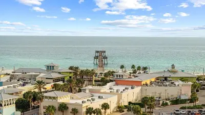 an aerial view of the beach and the ocean at West End Coastal Escape Renovated 1BR Condo w Pool Beach Access 72 in Panama City Beach